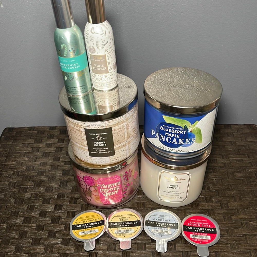 4 bath & body works candles, 4 car fragrance refills, and 2 room sprays
